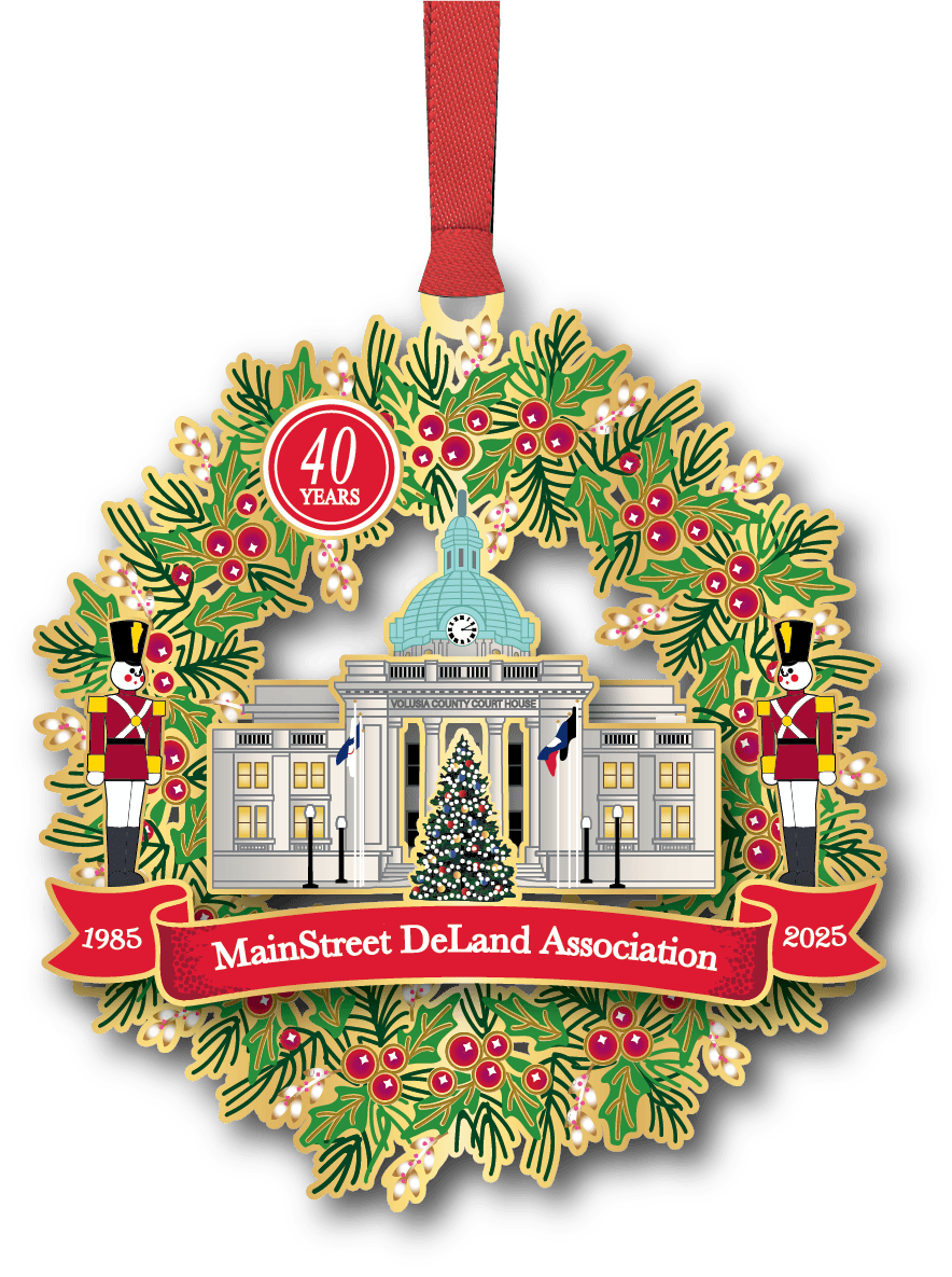 MainStreet DeLand Association 40 Years commemorative ornament featuring Volusia County Courthouse framed by a holiday wreath with toy soldiers and ribbon banner