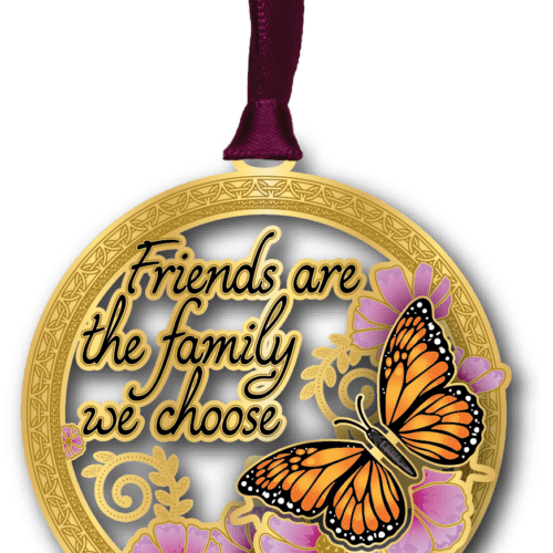 Round ornament featuring a monarch butterfly, pink flowers, and the phrase "Friends are the family we choose."