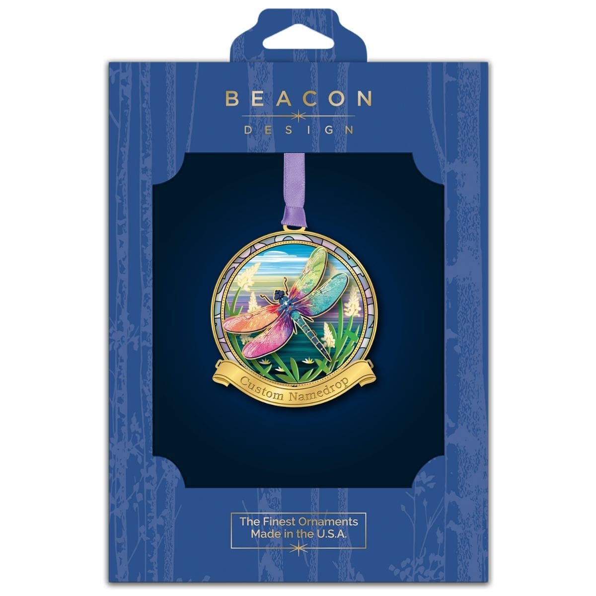 Dragonfly namedrop ornament from Beacon Design in retail packaging, featuring a colorful dragonfly with iridescent wings over a nature scene and a customizable banner.