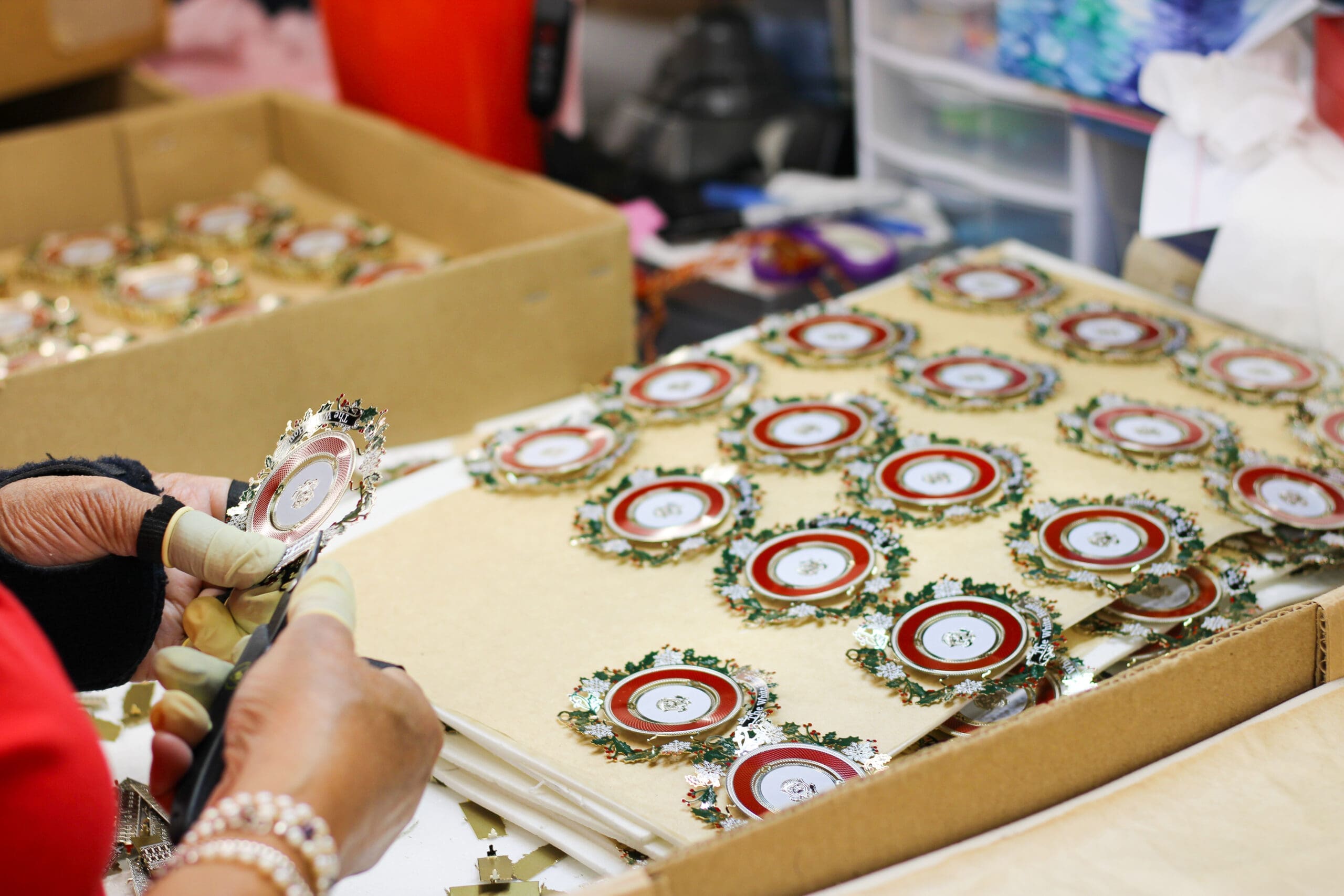 The Official 2025 White House Historical Association ornament being assembled.
