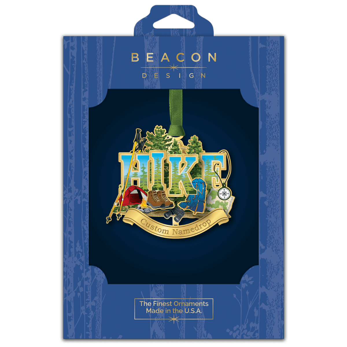 Custom namedrop ornament featuring hiking gear, a campsite, and forest landscape with the word “HIKE,” displayed in Beacon Design retail packaging