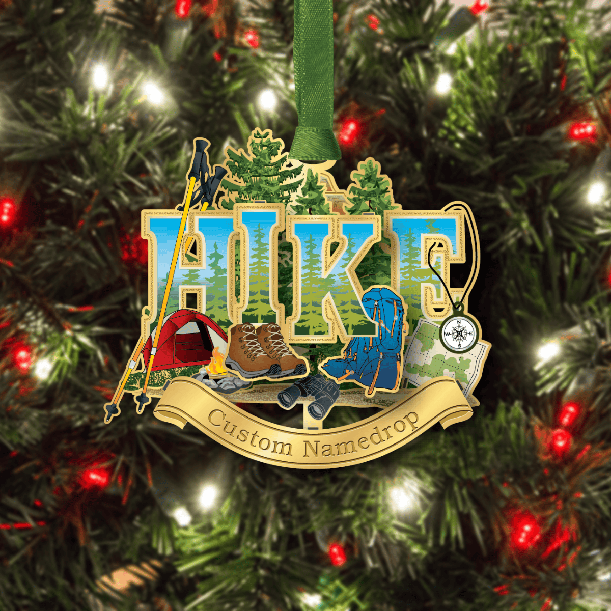 Custom namedrop ornament featuring hiking gear, a campsite, and forest landscape with the word “HIKE,” displayed on a decorated Christmas tree