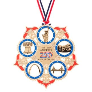 Back view of the America250 American Icons commemorative ornament featuring gold detailing, patriotic enamel, and engraved text reading “1776–2026 America 250 Made in the USA,” with surrounding iconic symbols.